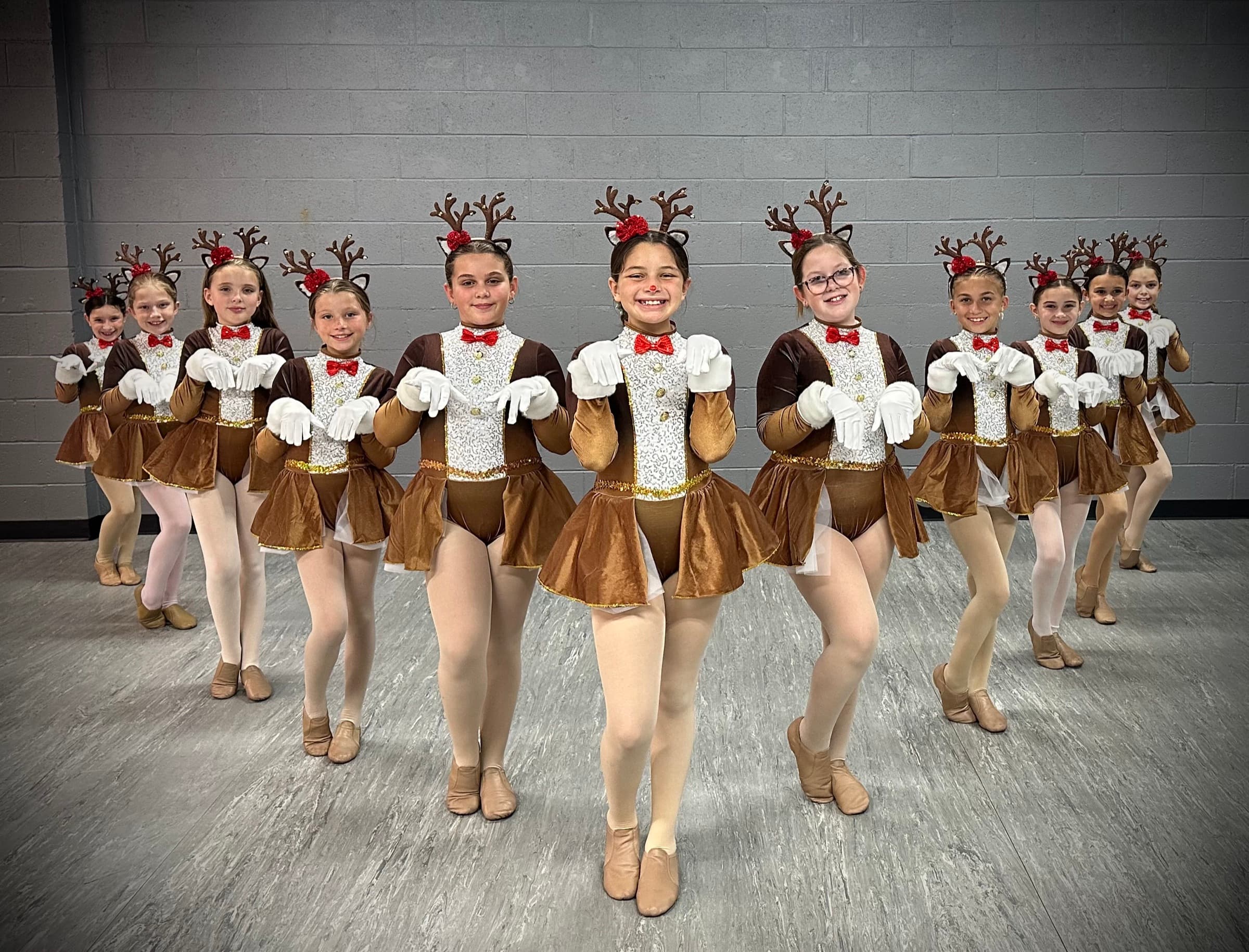 Tap class performing in reindeer costumes