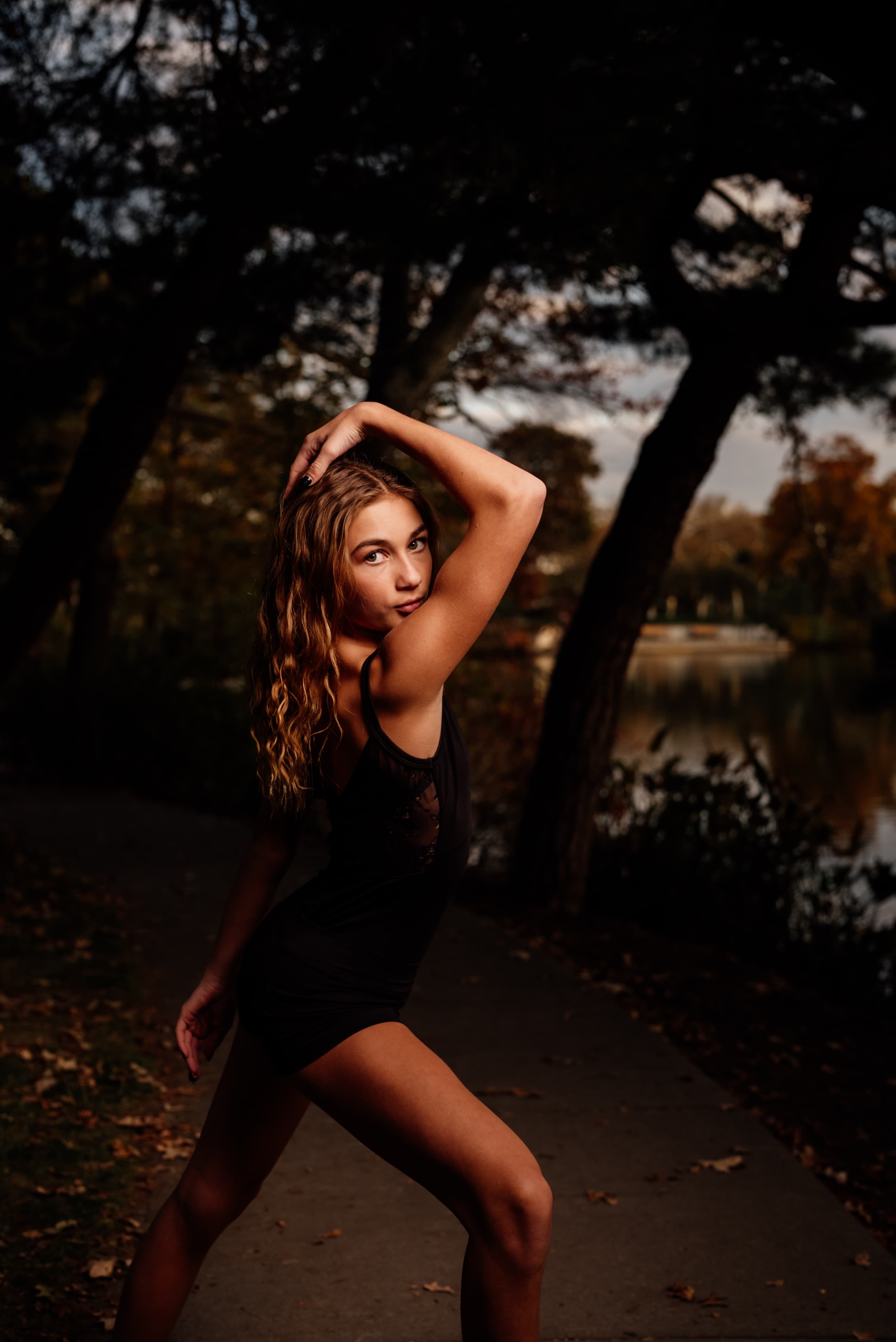 Dancer in a flowing, emotive pose with hair caught in motion