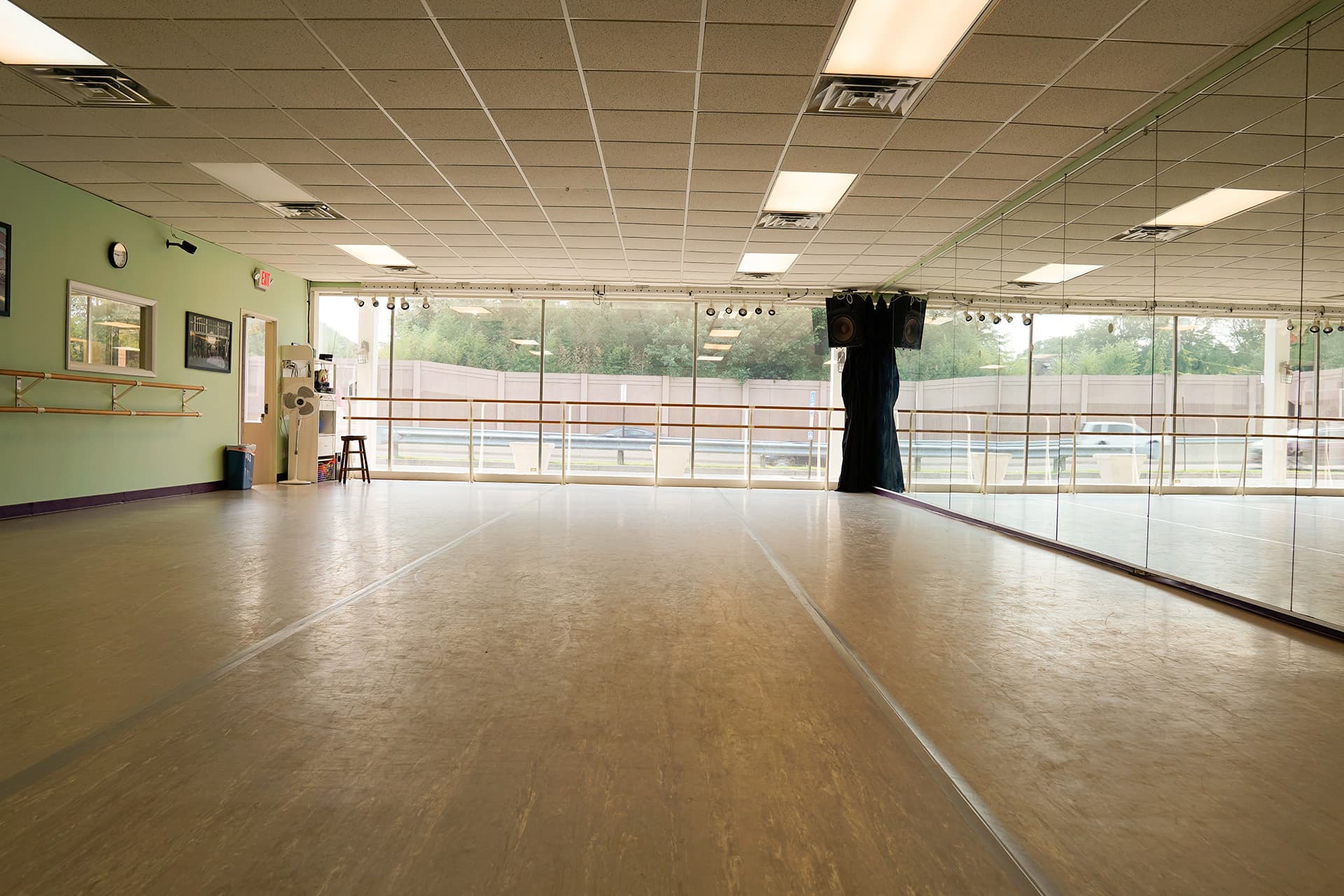 Spacious studio with mirrored wall and viewing window