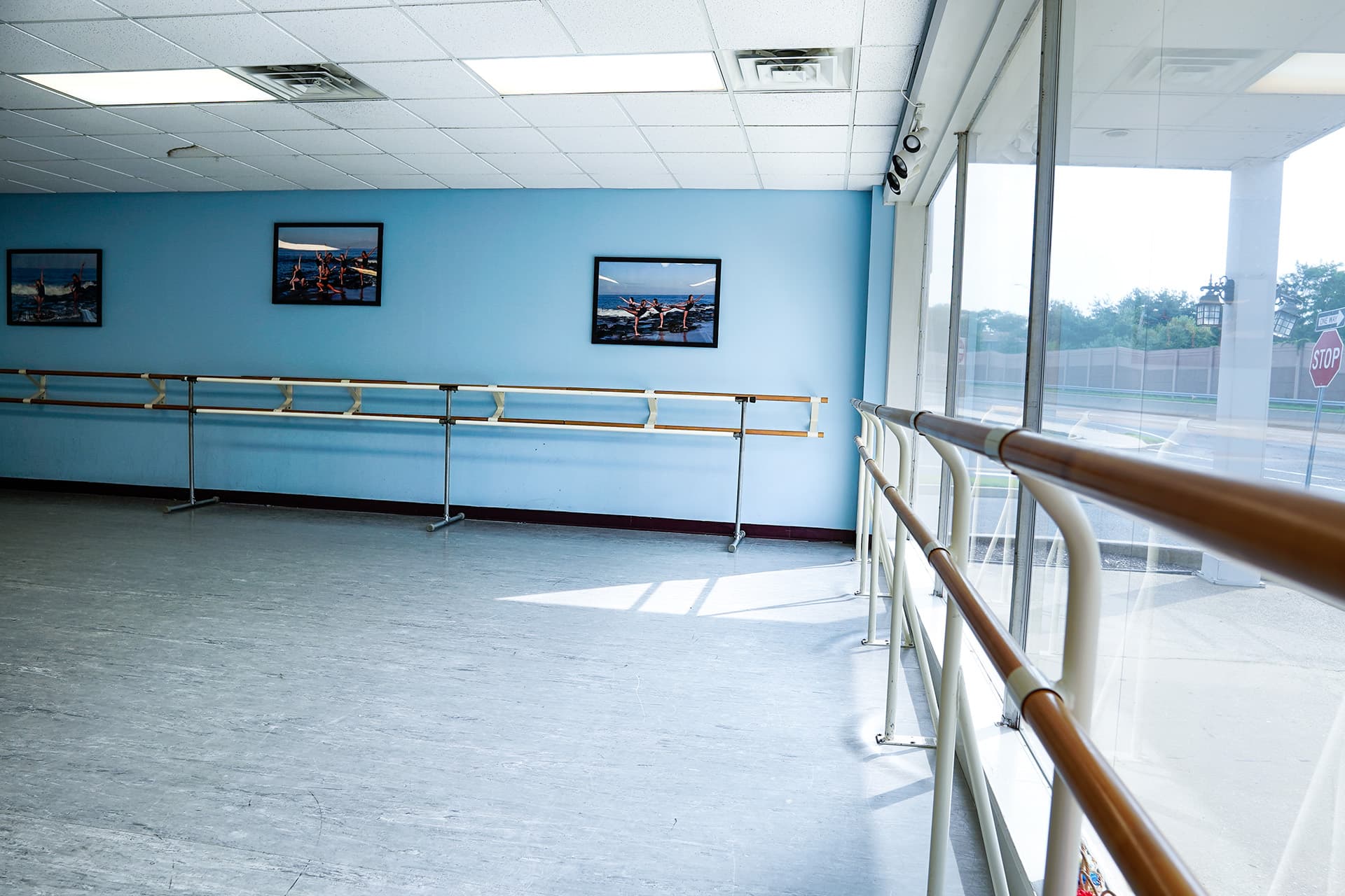 Dance studio with barre and framed photography